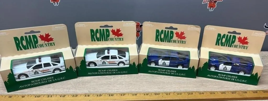 Four 1:43 RCMP Cruisers.