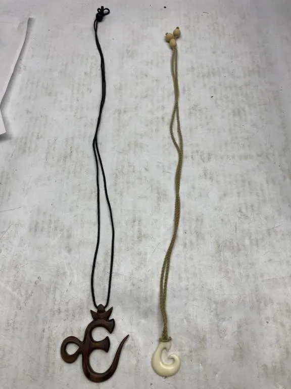 Two Carved Pendant Necklaces on Cords