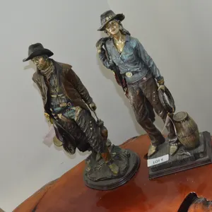 2 Western Cowboy and Cowgirl Statues