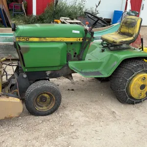 John Deere 300F Garden Tractor with Front Snow Blower, Rear Tiller, Tire Chains and Wheel Weights.