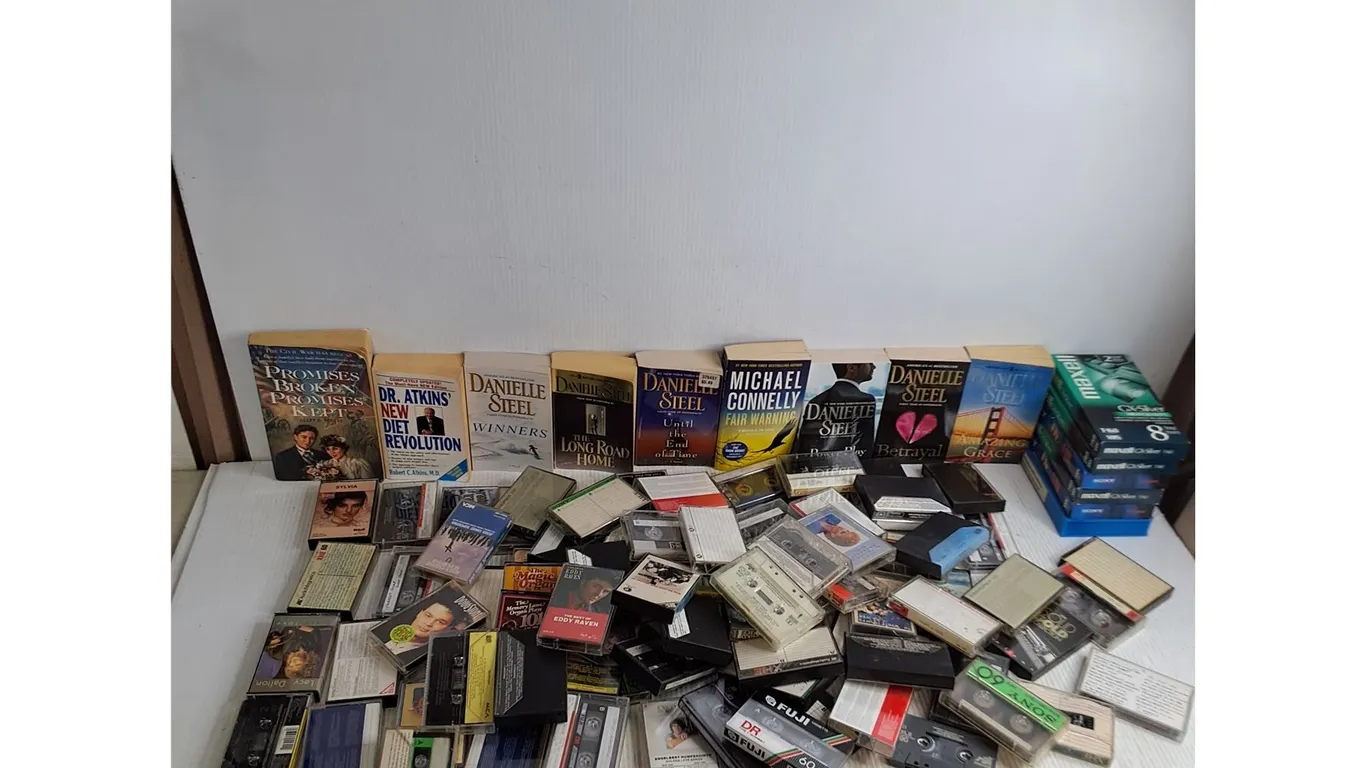 Large Assorted Lot of Novels, Cassette Tapes, VHS Dubs