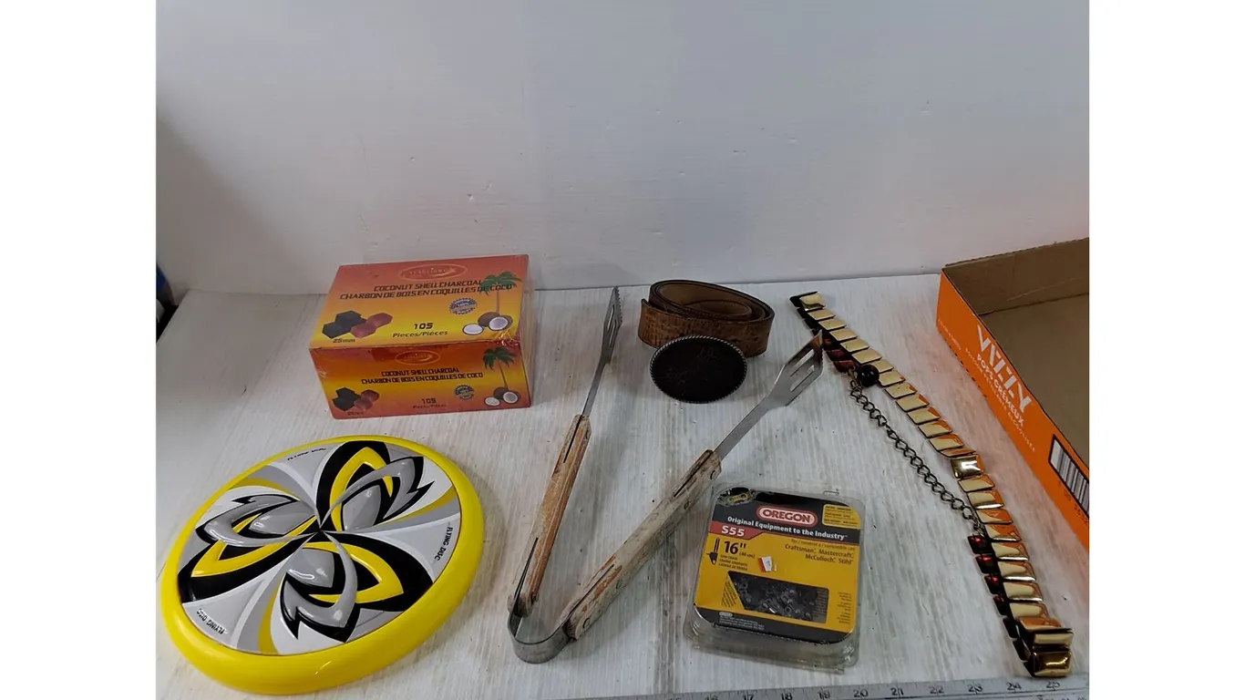 Yellow Frisbee, Coconut shell Charcoal, Tongs, Leather Belt, Saw Chain, Misc