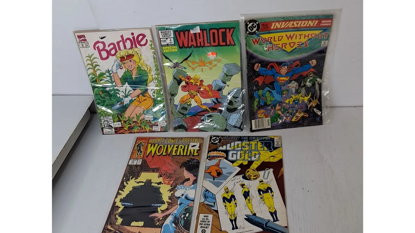 (5) DC/Marvel Comics- Barbie, Wolverine, Booster Gold, Misc.