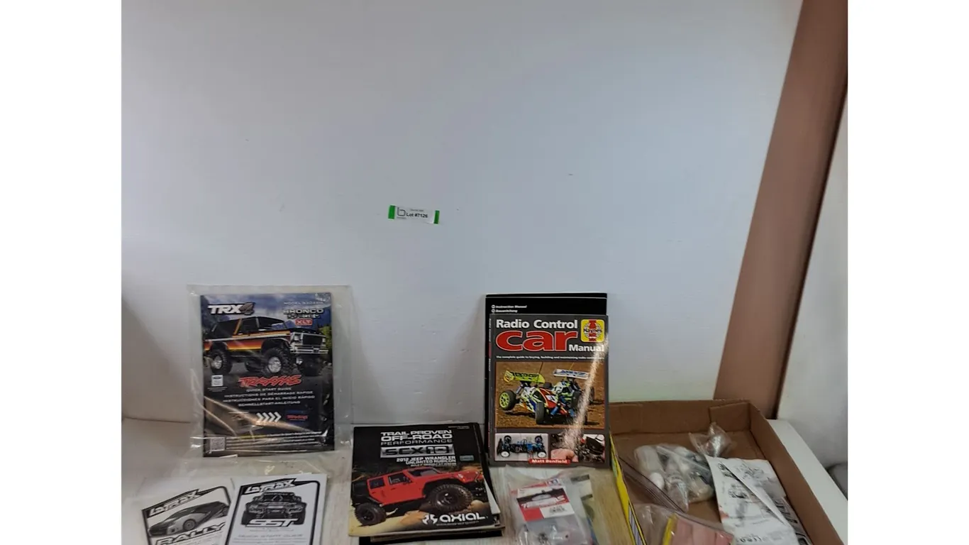 Assorted Radio Control Car Manuals, Accessories, Putty, Replacement Parts