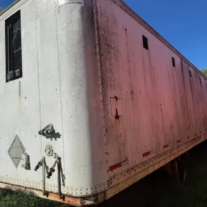 *OFFSITE* 53 FT HIGHWAY VAN CONVERTED TO SWINE HAULING TRAILER, HINGED DIVIDEDER WALLS W/ CUSTOM VERTRICAL LIFT REAR DOOR (NO VIN) - PLEASE CALL RONIE