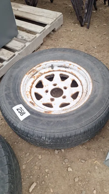 Tire with rim. Size 215/70R15