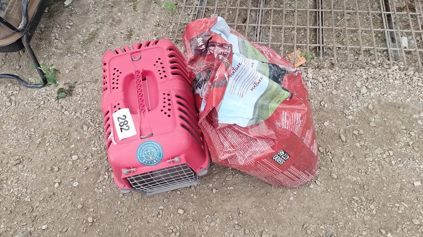 Pet carrier and a full bag of Purina dog food 12.4 kg