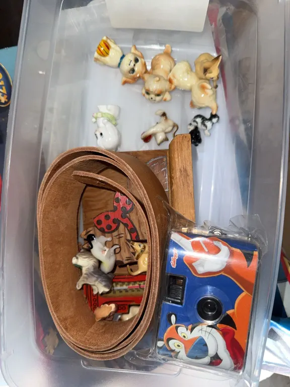 Lot: Tony the Tiger Kellogg's Camera, Ceramic Animal Figurines, Belt, and Wooden Thermometer Decor