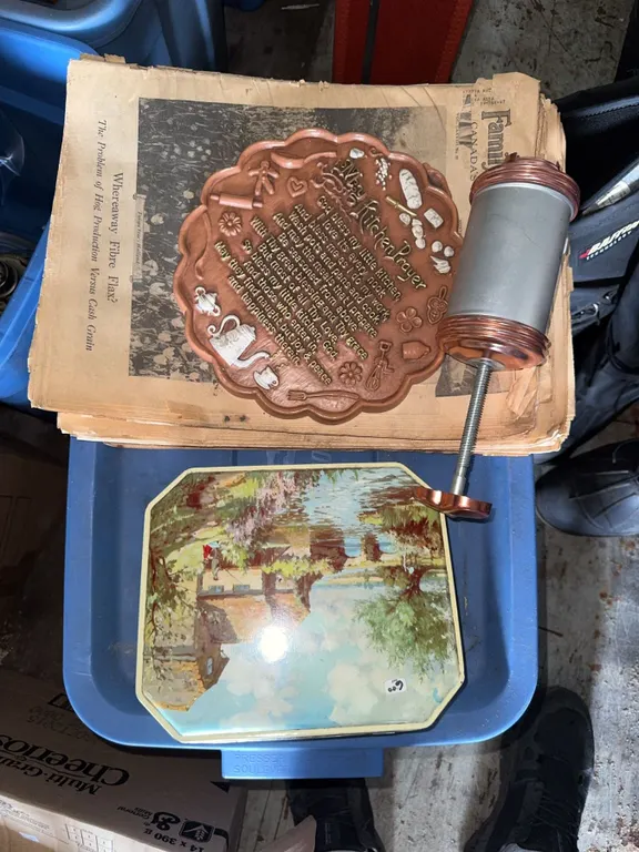 Decorative Items Including Tin, Wall Hanging, and Roller