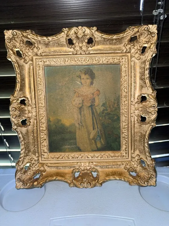 Framed Print of Young Girl Holding a Lamb in Ornate Gold Frame