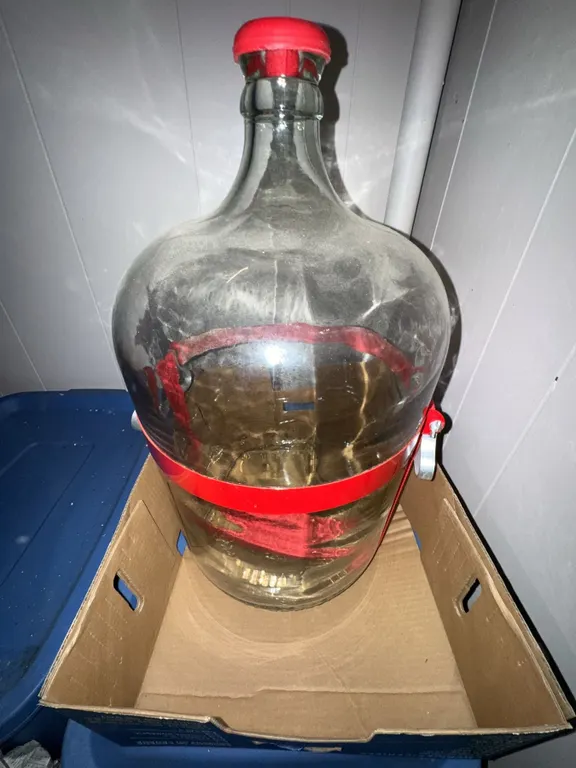 Large Clear Glass Carboy with Red Plastic Handle and Cap