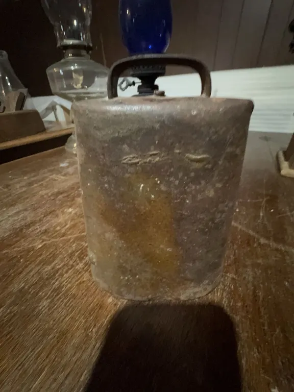 Antique iron cowbell.