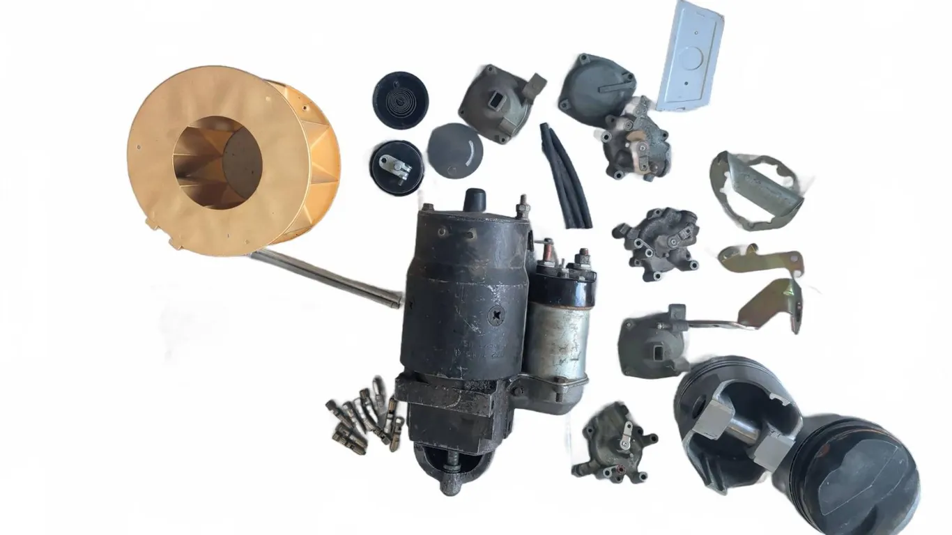 Automotive Parts Lot Including Starter, Pistons, Brass Valves, and RGM8-ZC Repair Kit