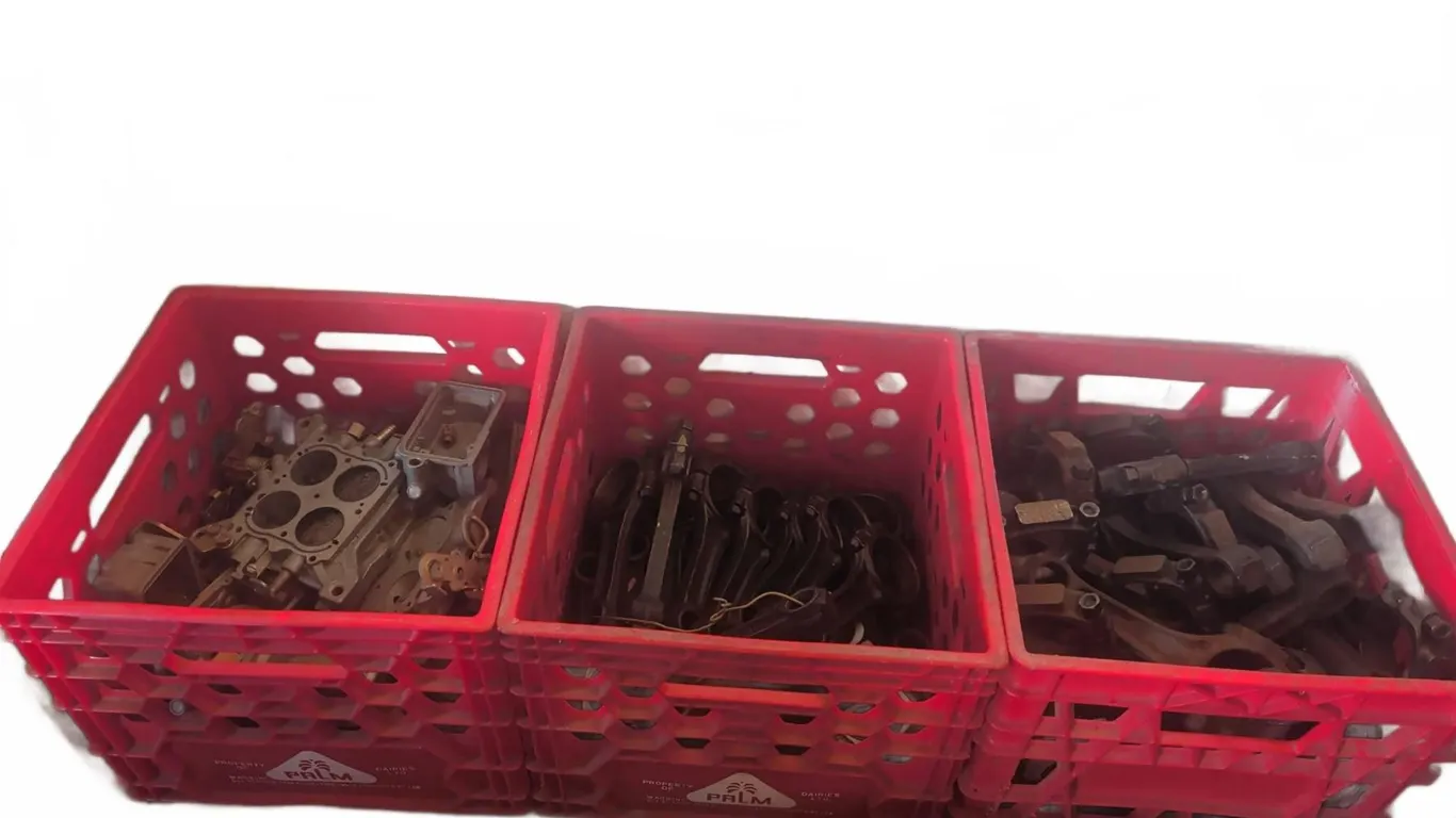 Automotive Engine Parts in Three Red Crates