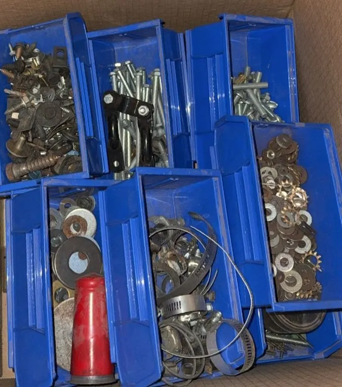 Hardware Fasteners and Clamps in Blue Plastic Bins