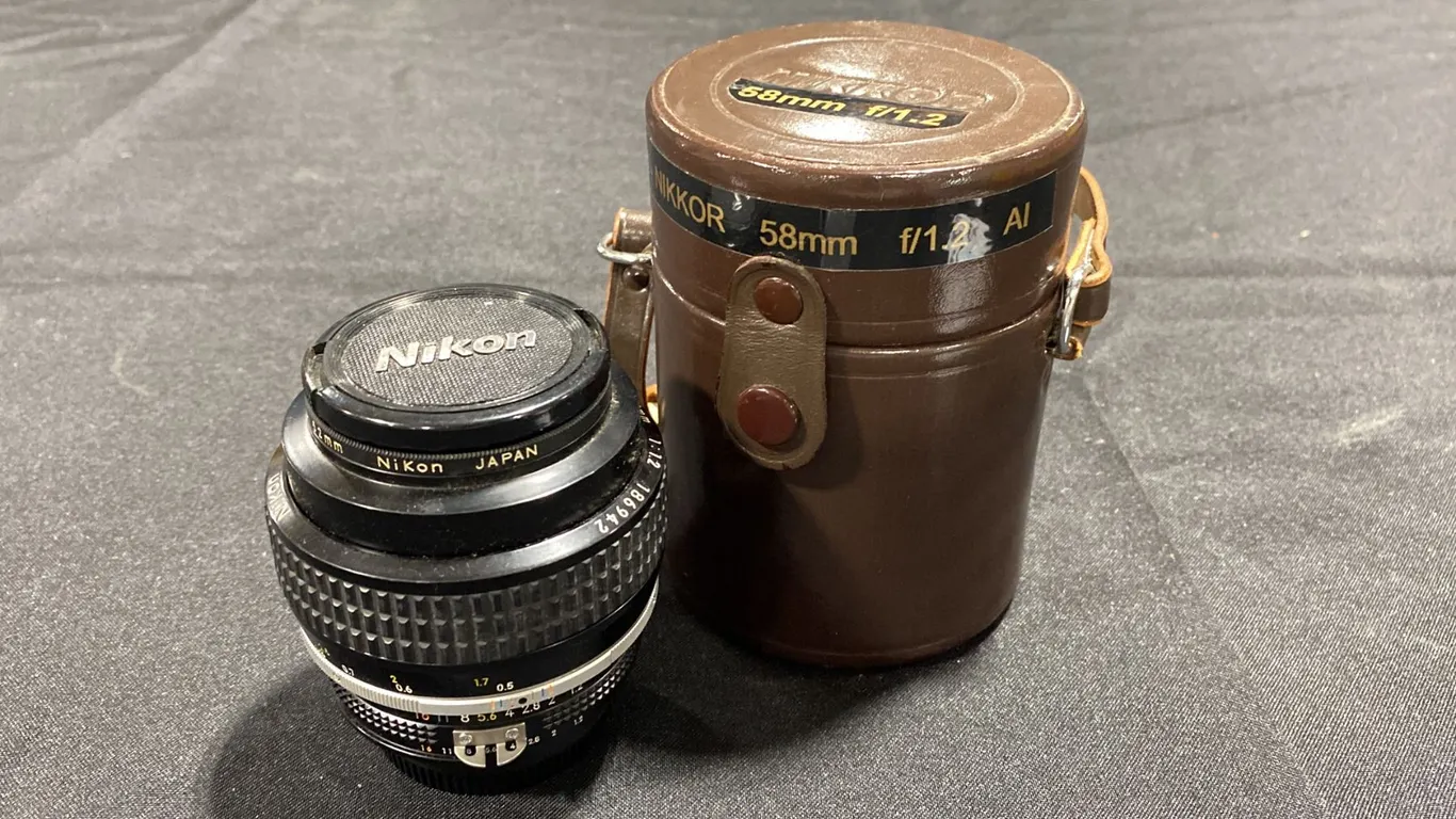 NOCT-NIKKOR 58MM F/1.2 AI LENS WITH NIKON L1BC 52MM SKYLIGHT UV FILTER & CASE