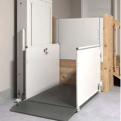 BRUNO VPL-3153B BATTERY-POWERED VERTICAL PLATFORM LIFT MIXED WITH PRIDE MOBILITY JAZZY CARBON POWER