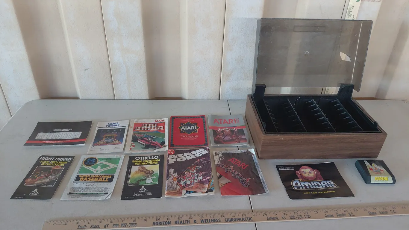 Atari Game Holder, 1983 Popeye Game (Has Damage), & Booklets-Super Challenge Baseball, Othello, Nigh