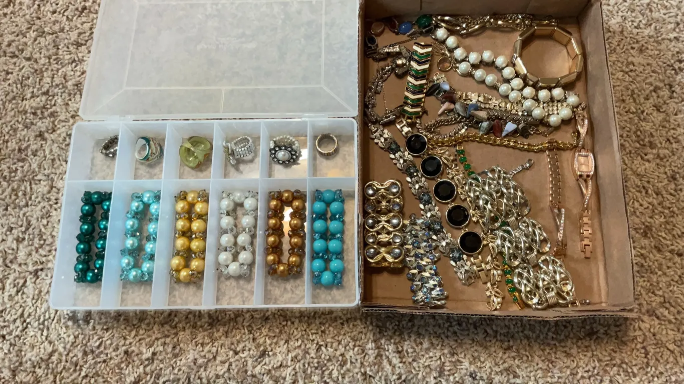 Two containers of jewelry