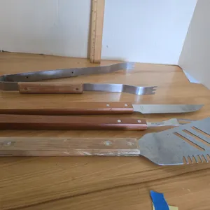 Set of wood handled stainless steel grillware