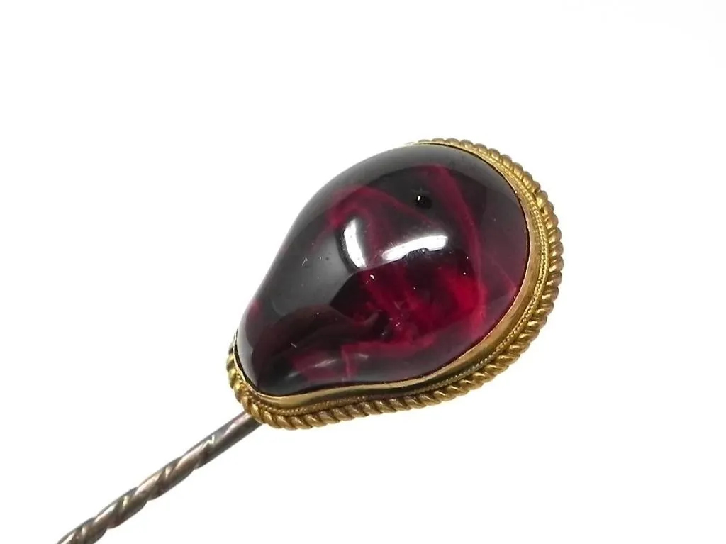 GARNET SET IN 14KT GOLD ON NON-PRECIOUS PIN $300