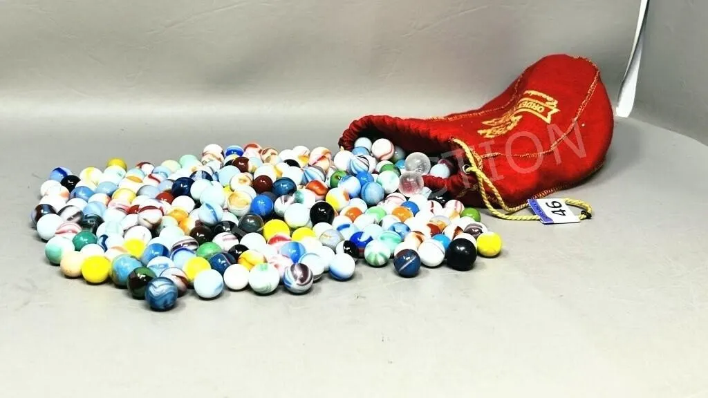 vintage marble collection in red fabric bag