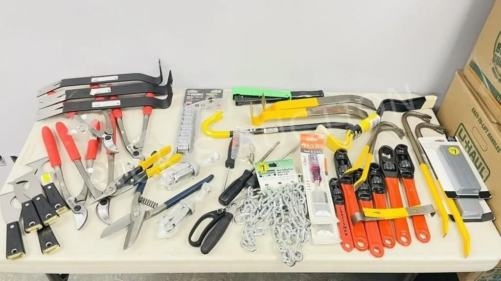 bin full of shears, snips, pry bars, chisels