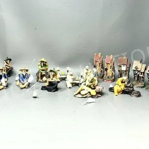 collection of resin mud men figures & houses