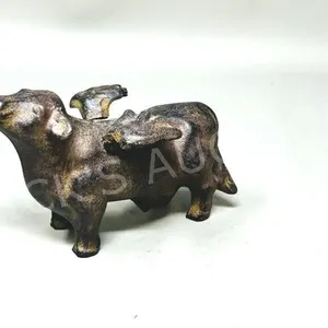 cast metal flying cow - 4" h x 5" long