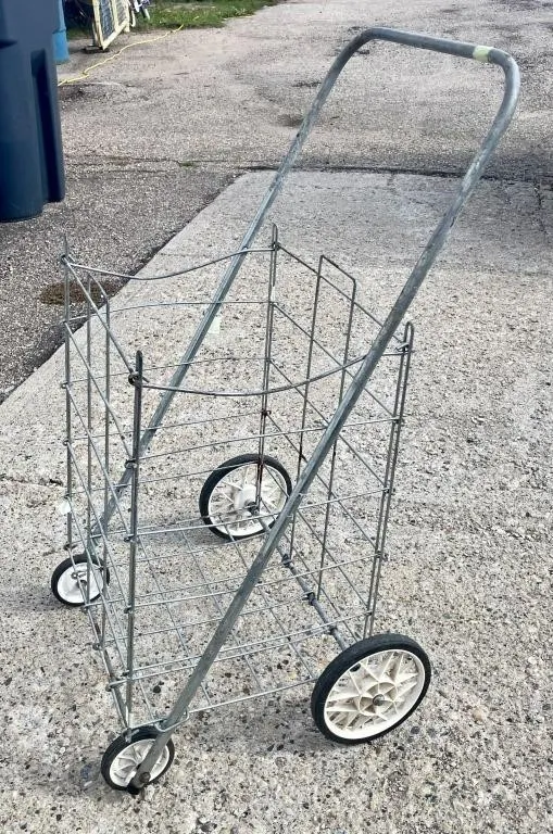 Folding rolling utility cart.