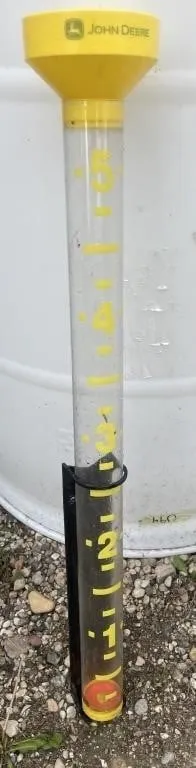 John Deere 26-inches tall rain gauge. Works.