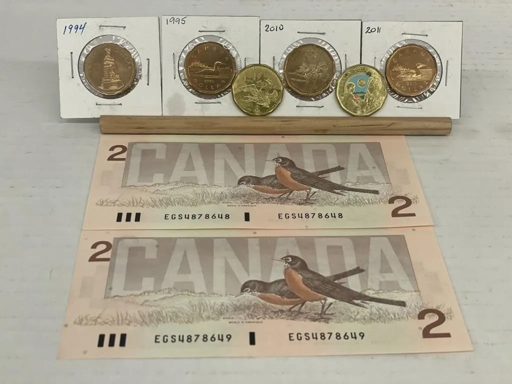 RCM six loonies and two $2 bills with consecutive