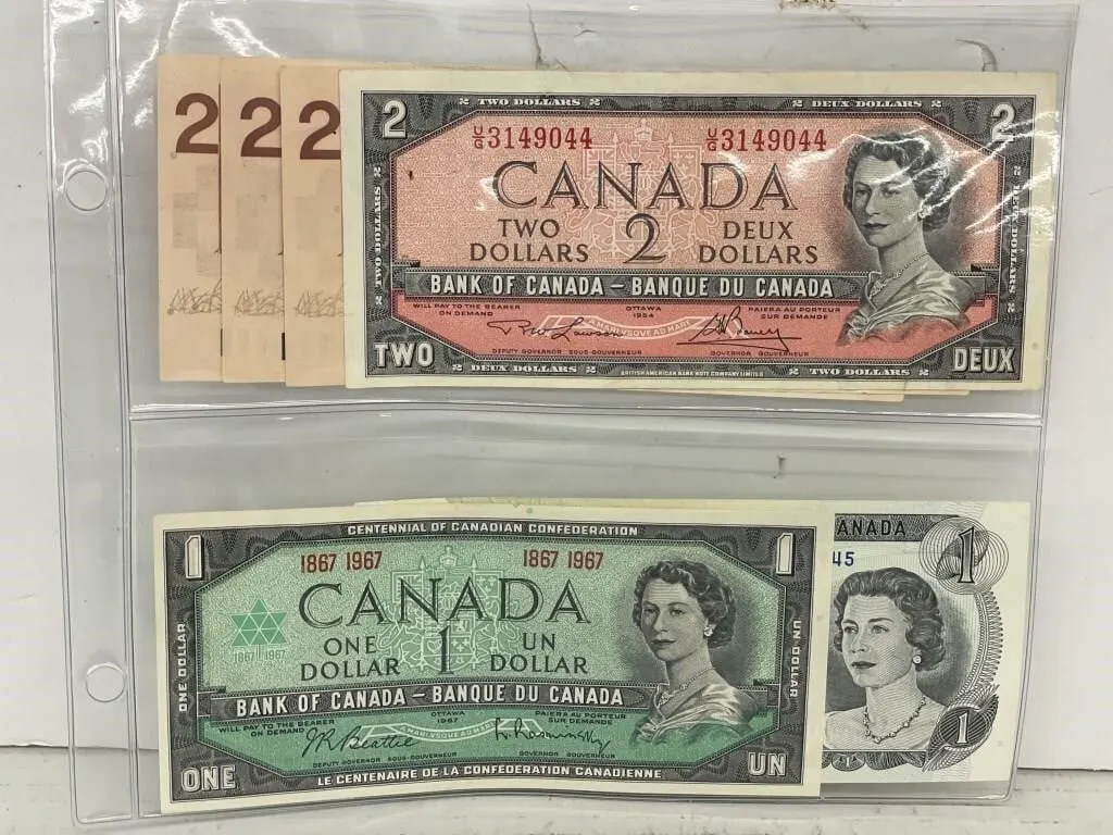 Set of four $2 Canadian bills, and two $1 bills.