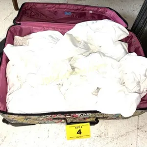 SUITCASE FULL OF WHITE SHEETS