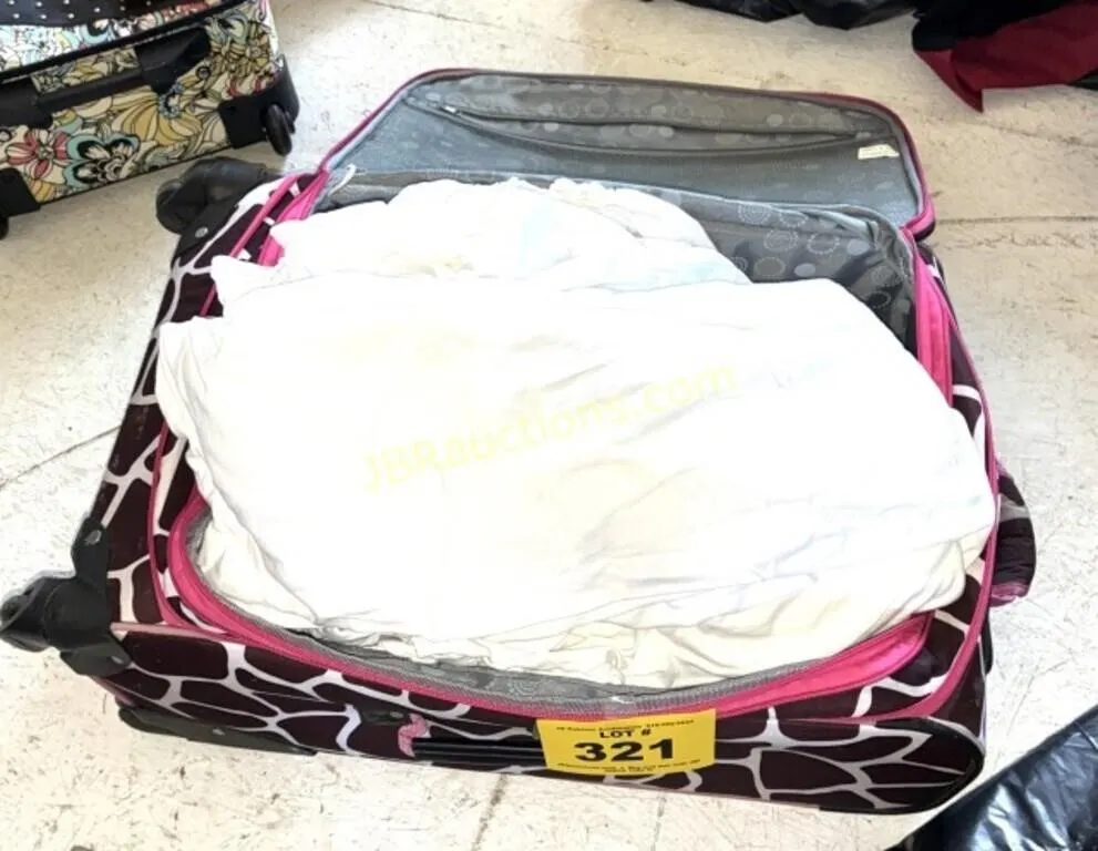 LUGGAGE WITH WHITE SHEETS