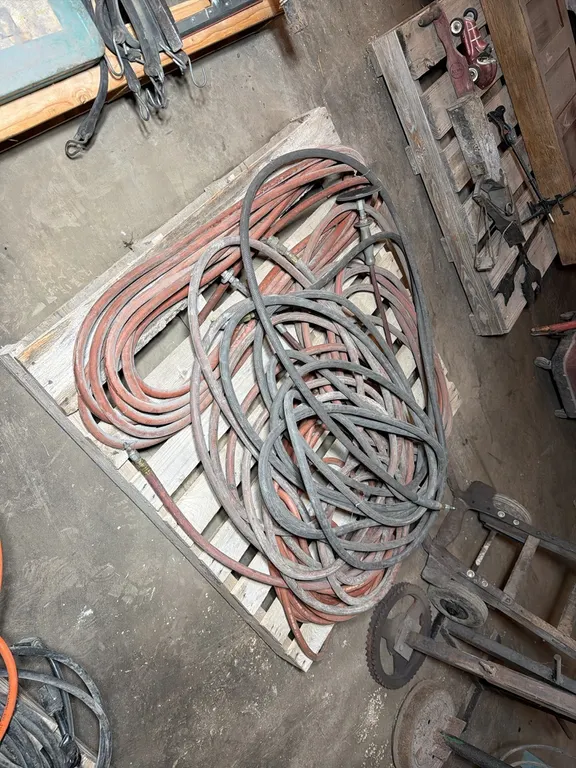Large quantity of assorted air hose & pneumatic grinder
