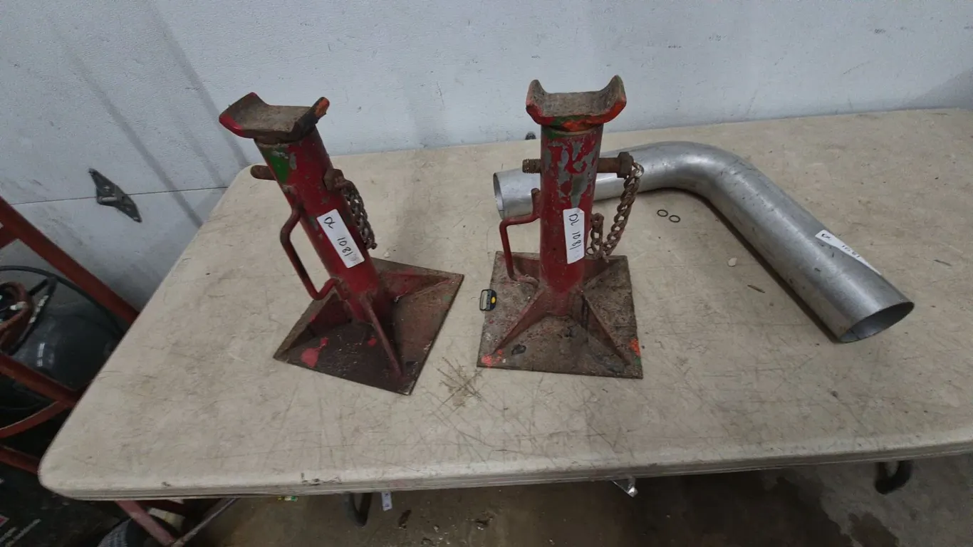Pair of Red Jack Stands and Muffler pipe Pipe