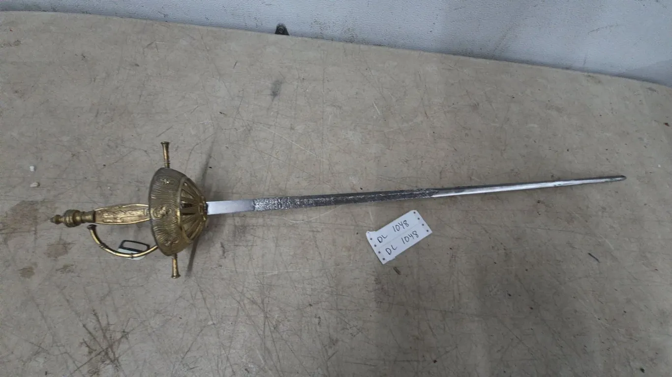 A Rapier Sword with Ornate Hilt and Engraved Blade 39”