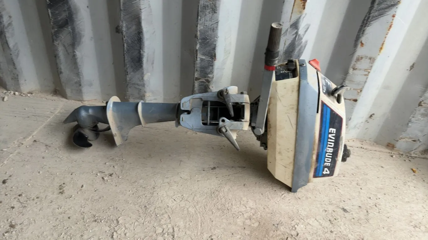 Evinrude 4 Outboard Motor with Propeller and Controls