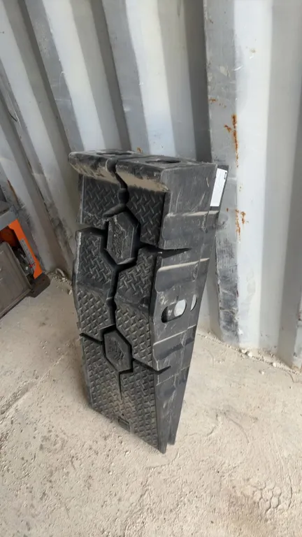 Rhino Ramps: 2 Black Plastic Vehicle Ramps (Small Crack in Base of One)