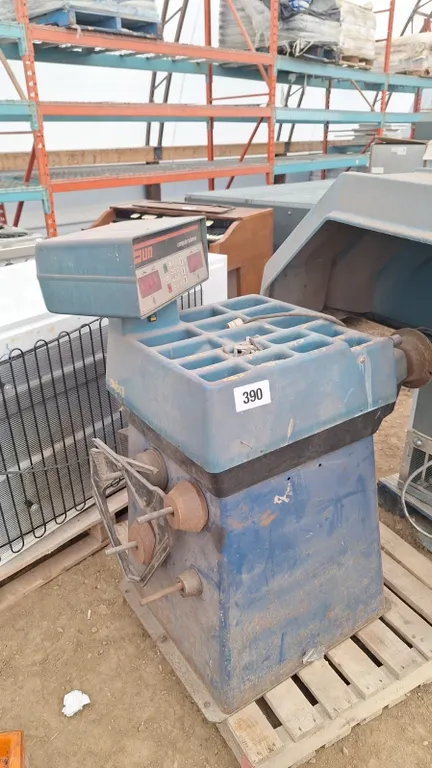 Used "Sun" tire balancer with weights, needs work, turns on, spns tine, but always recommends max amount of weights, model CWB - 1752