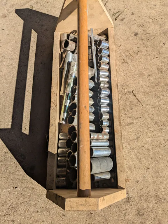 Wood tool box with assorted sockets