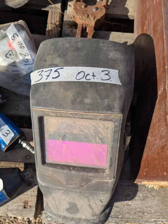Auto darkening welding helmet with extra lenses