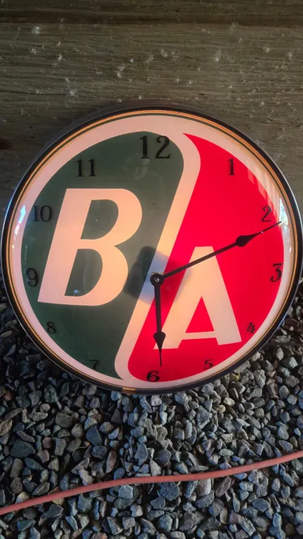 B/A British American Clock – Working. Made from a globe lens & display light. Electric ba