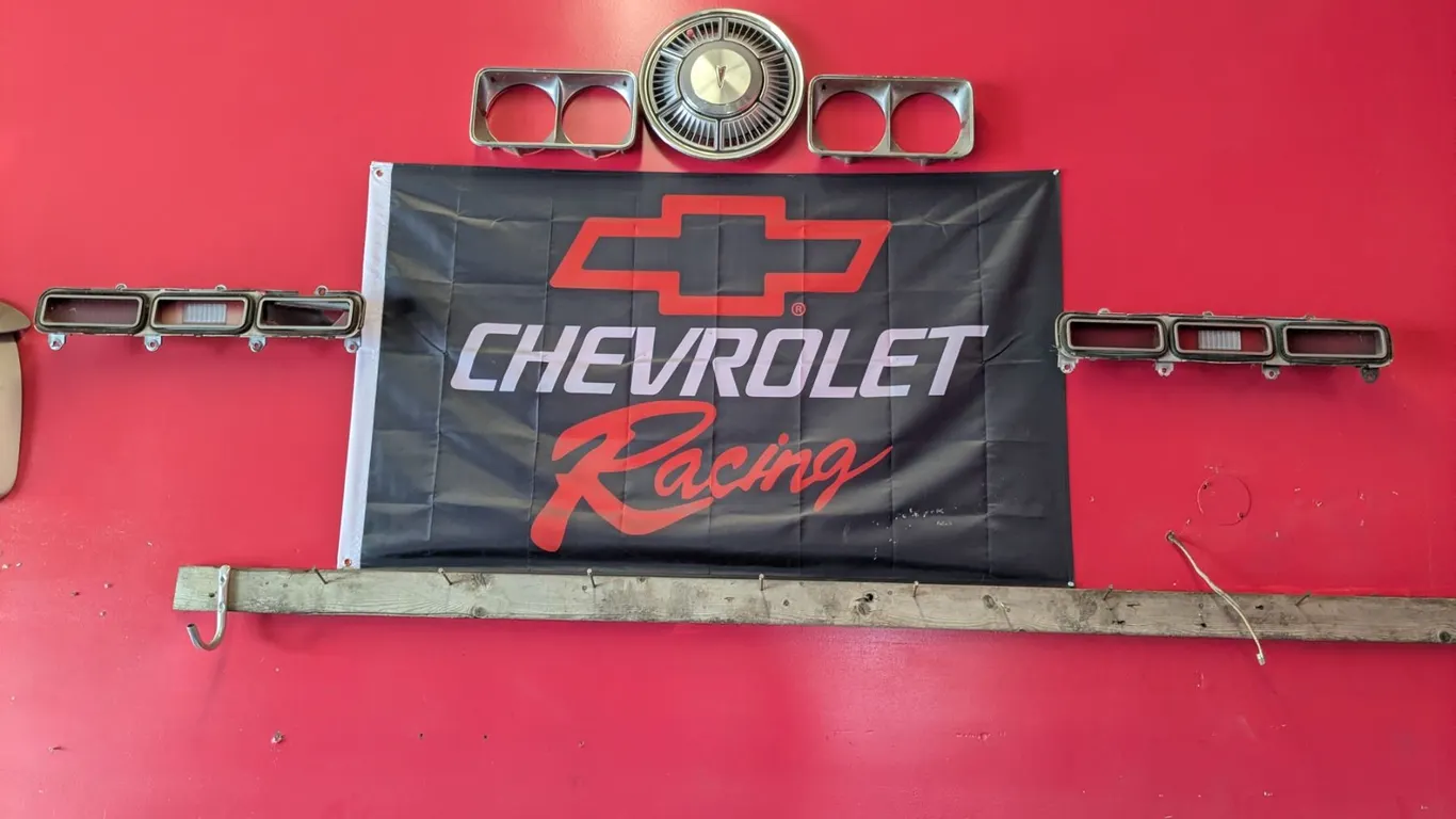 *OFFSITE* Wall Display – As is. 36”x 60” Flag w/ Car Parts