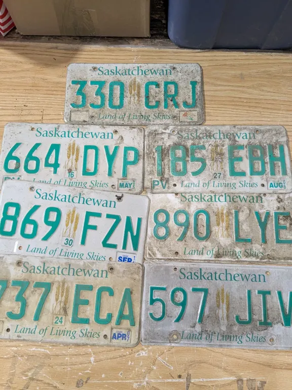 7 mixed sask license plates