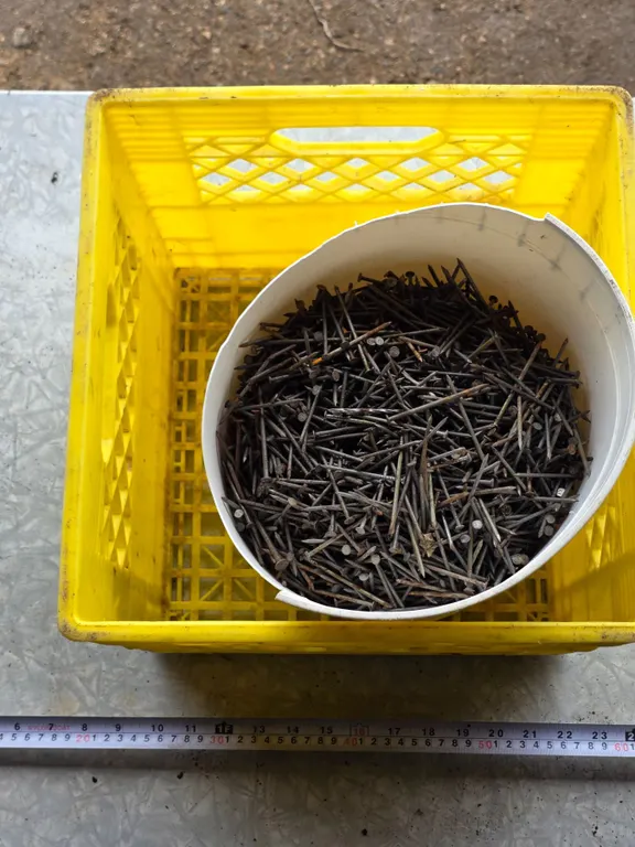 Bucket of nails and milk crate