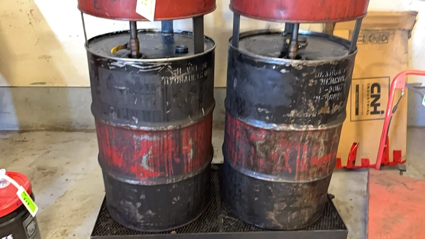 Used Oil Containers on Rolling Rack
