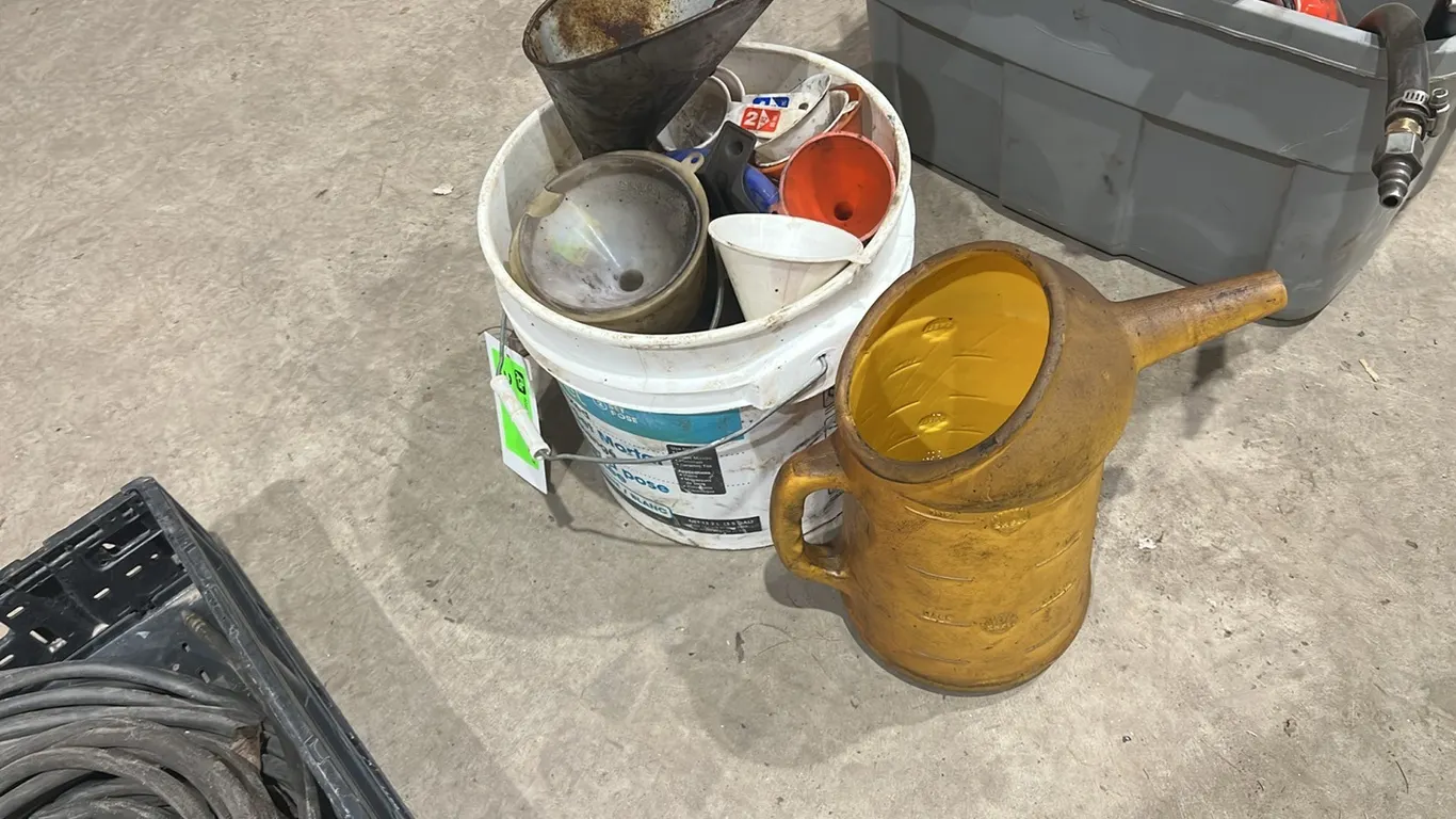 Large Assortment of Funnels and Oil Jugs