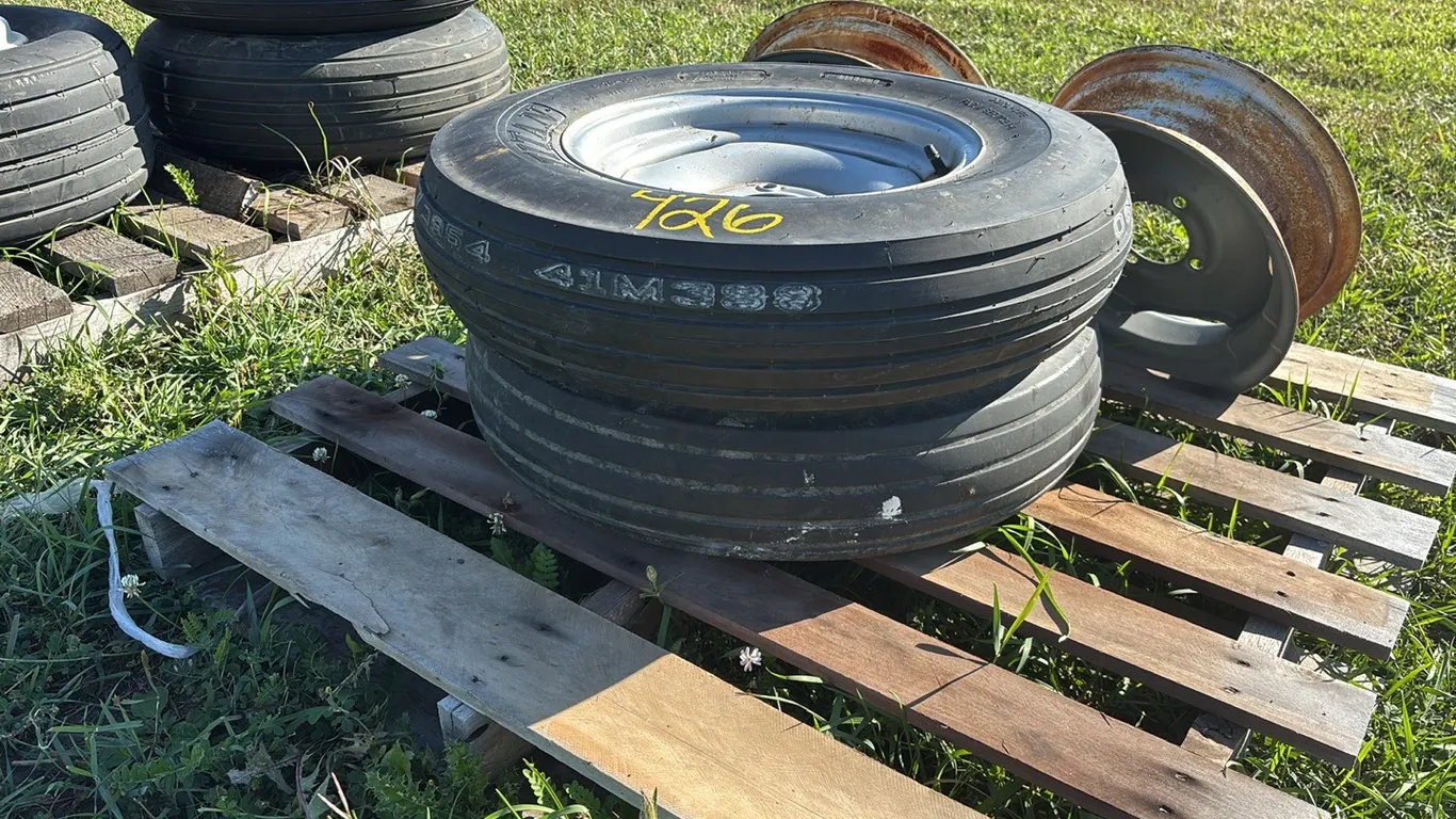 (1) New Titan 6.70-15SL 4 Bolt Implement Rim (1) Used Goodyear 6.70-15SL Tire and (2) 4 Bolt Implement Rims
